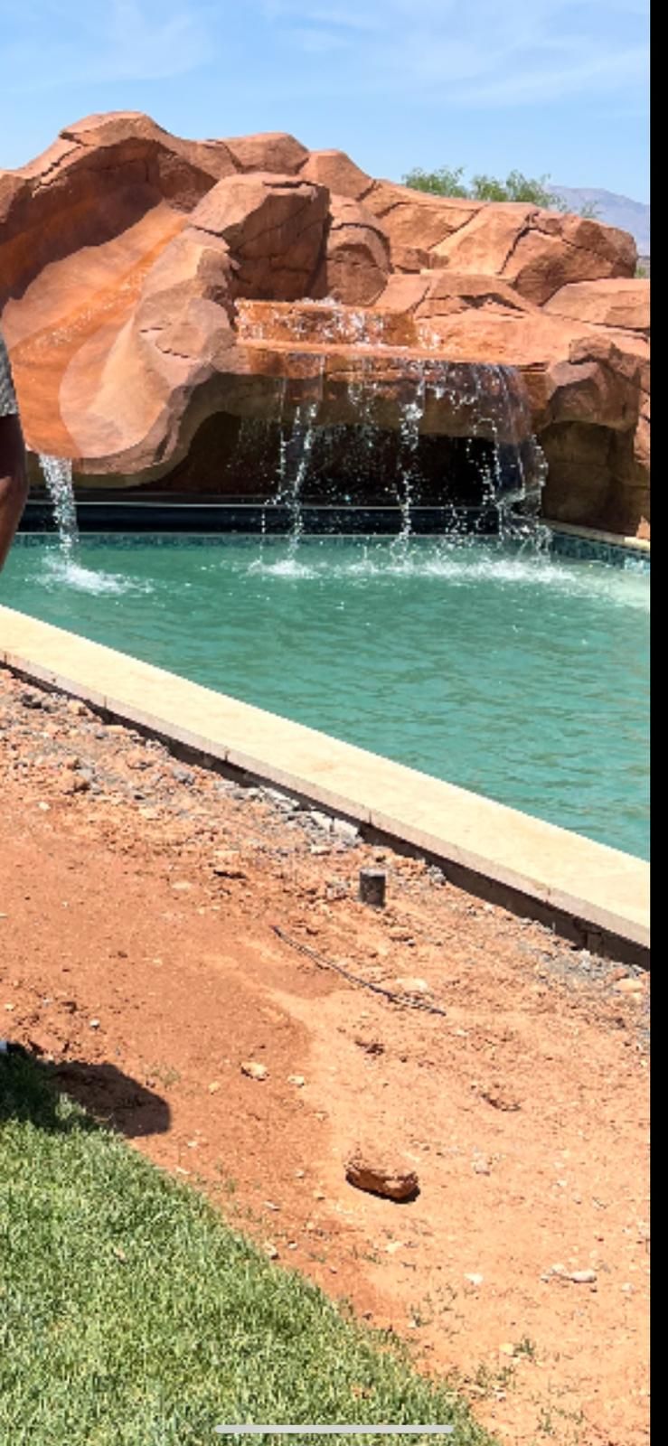 A rock waterfall feeding a pool