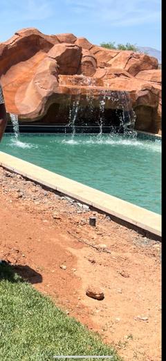 A rock waterfall feeding a pool