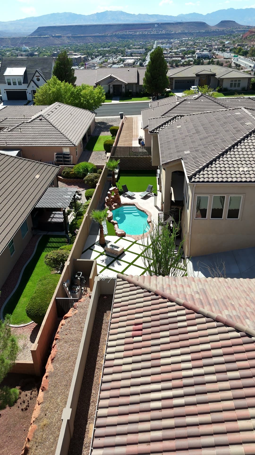 Aerial view over Southern Utah backyards with the mesas behind